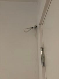 Wires hanging by door