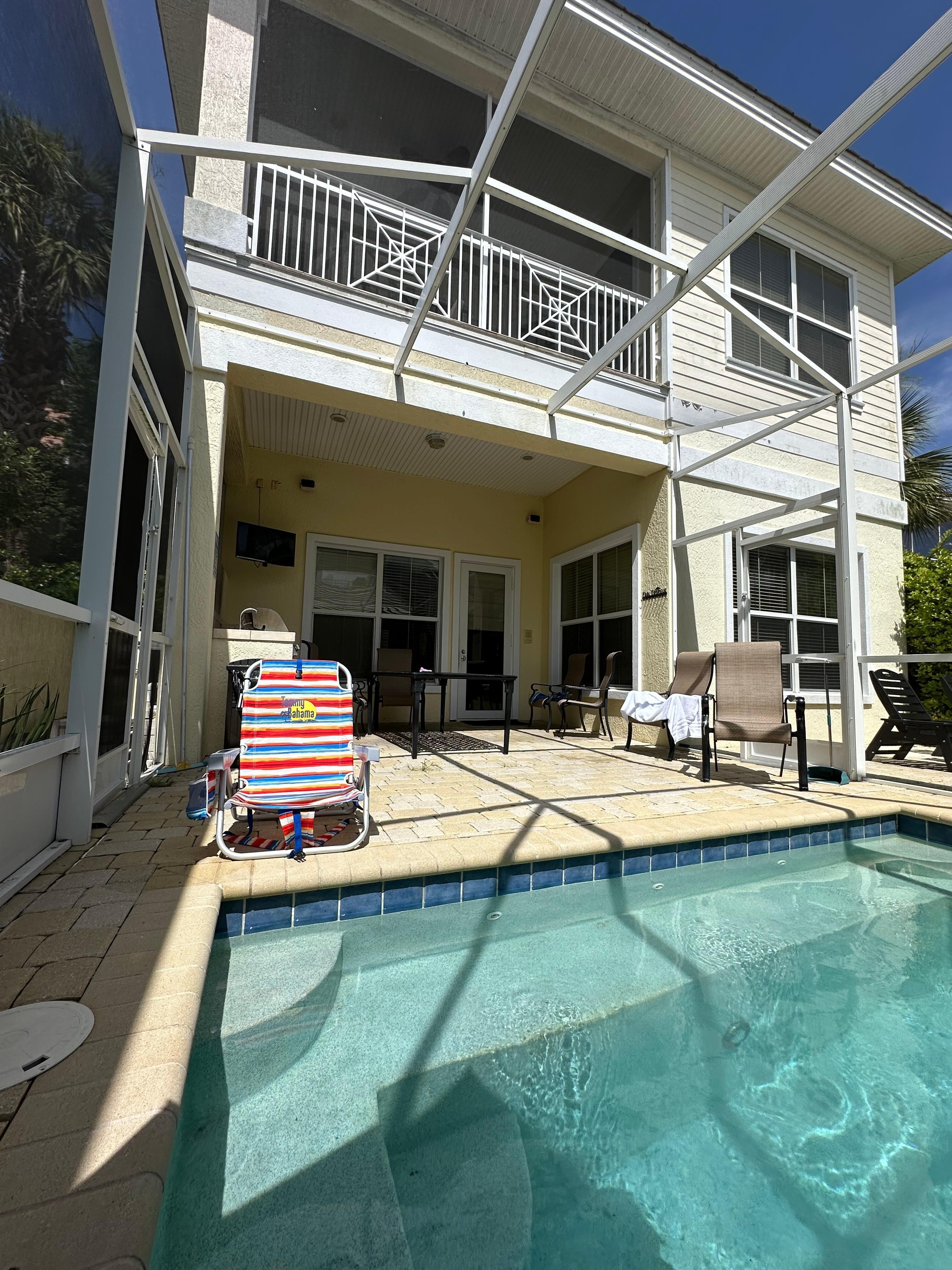 Back porch looking up to the second floor. Pool looks cleaner than it actually was 😬