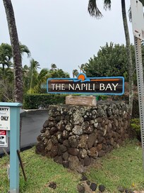 Turn left into parking lot — address 33 Hui.