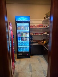 small snack room with some people being charged and not others.
