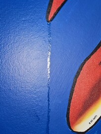 Theater room wall, food stuck on it.