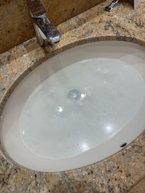 Washroom sink plug did not work.