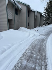 Nicely shoveled sidewalks to the condo