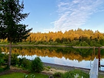 TA 5:45 AM view of the river casts sunlight on the green trees so they look golden! Worth waking up for.