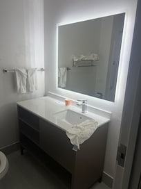 Bright and clean bathroom, with unlimited hot water.