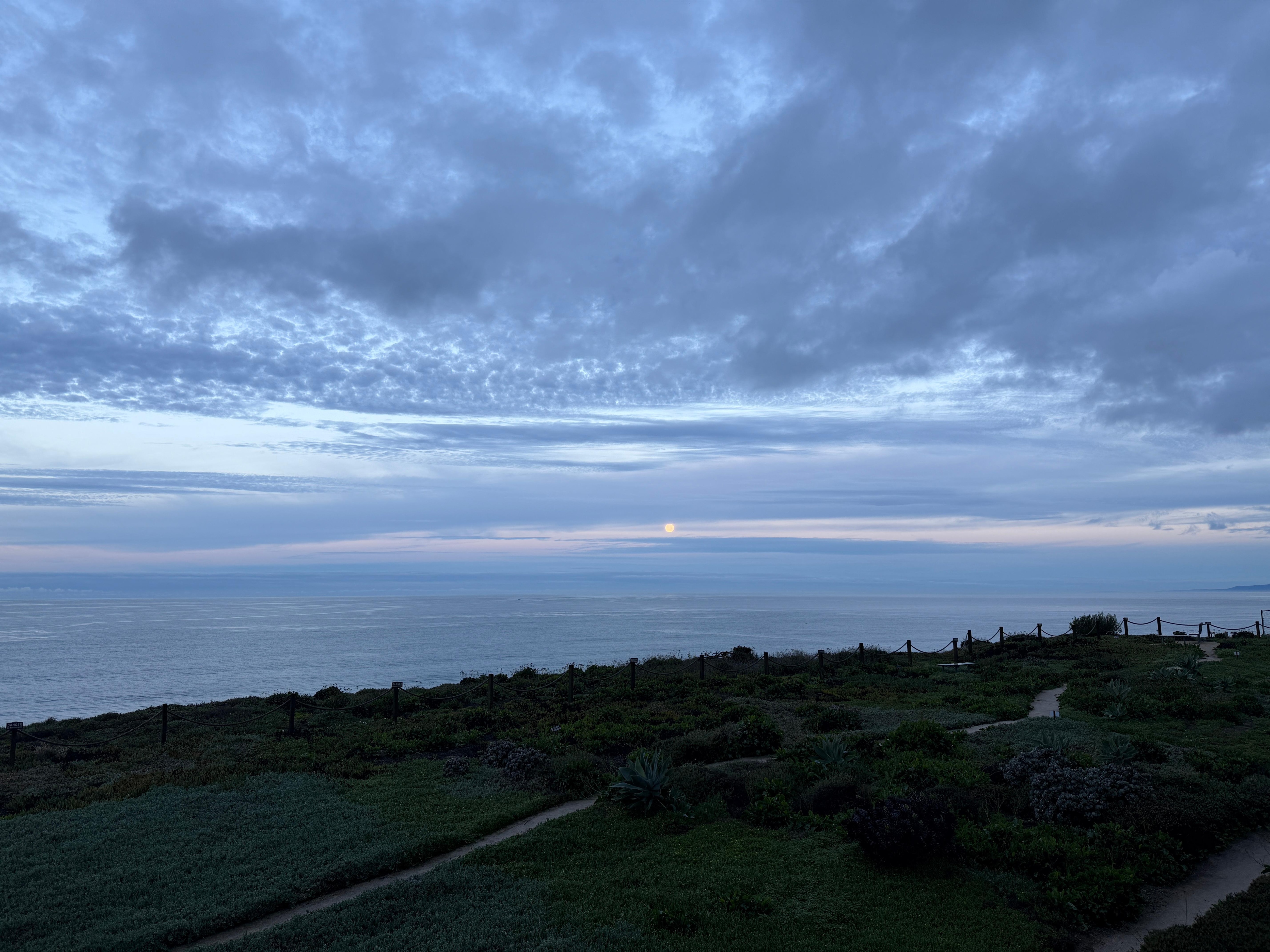 Picture of moon setting in the morning from the balcony. 