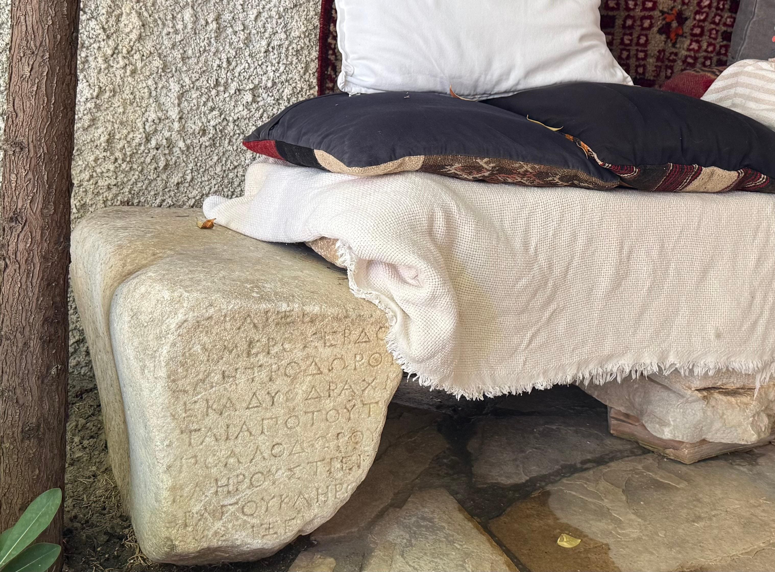 The courtyard is filled with ancient artifacts procured during construction and repurposed in a meaningful way 