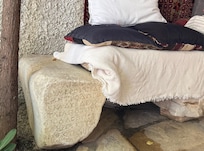 The courtyard is filled with ancient artifacts procured during construction and repurposed in a meaningful way