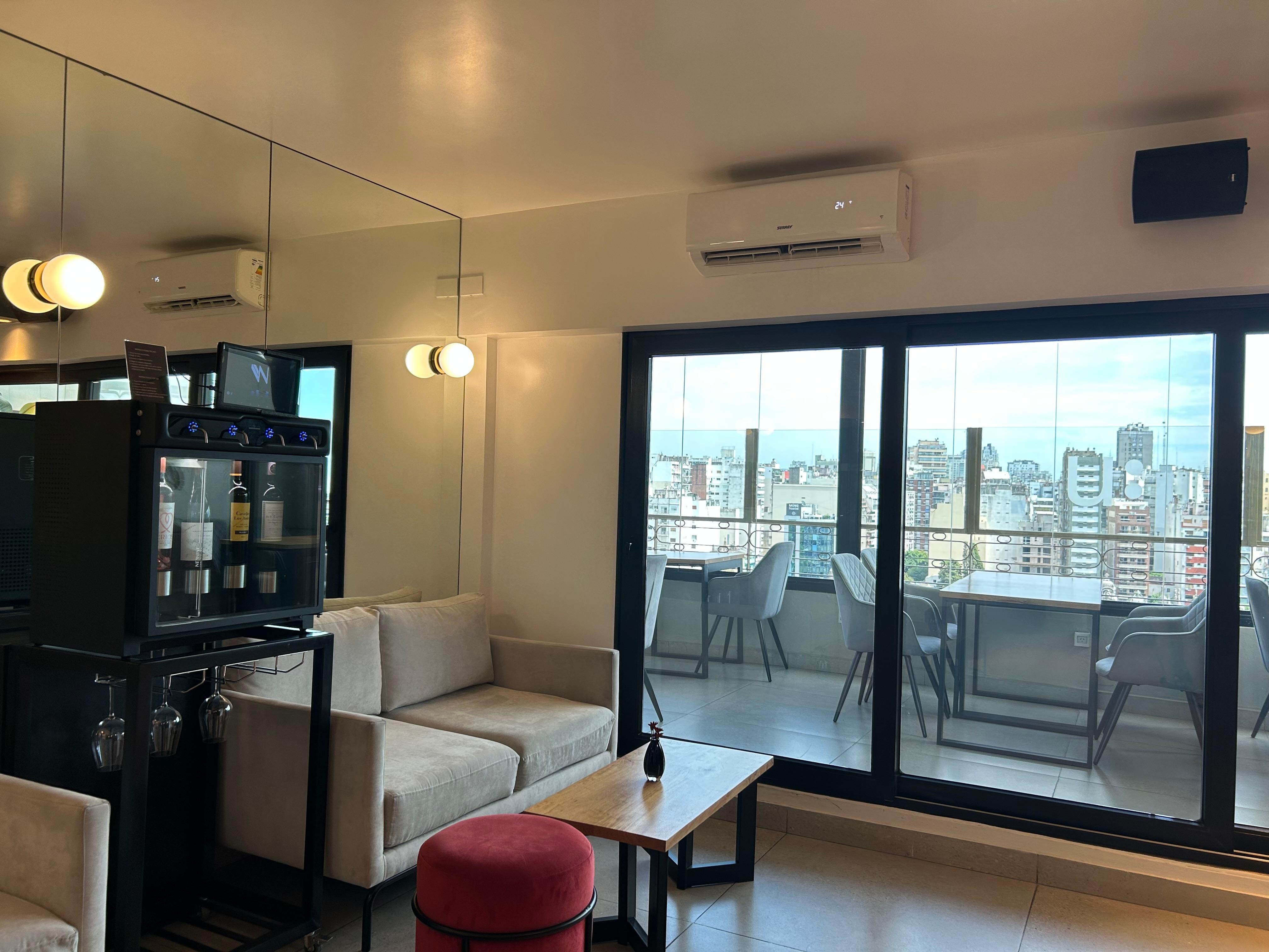 No bar, self service paid glass wine machine. But great view from this top floor