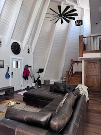 Family room and stairs up to two bedrooms, loft and laundry