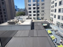 View from room of rooftop bar open til 11/12 but not much noise