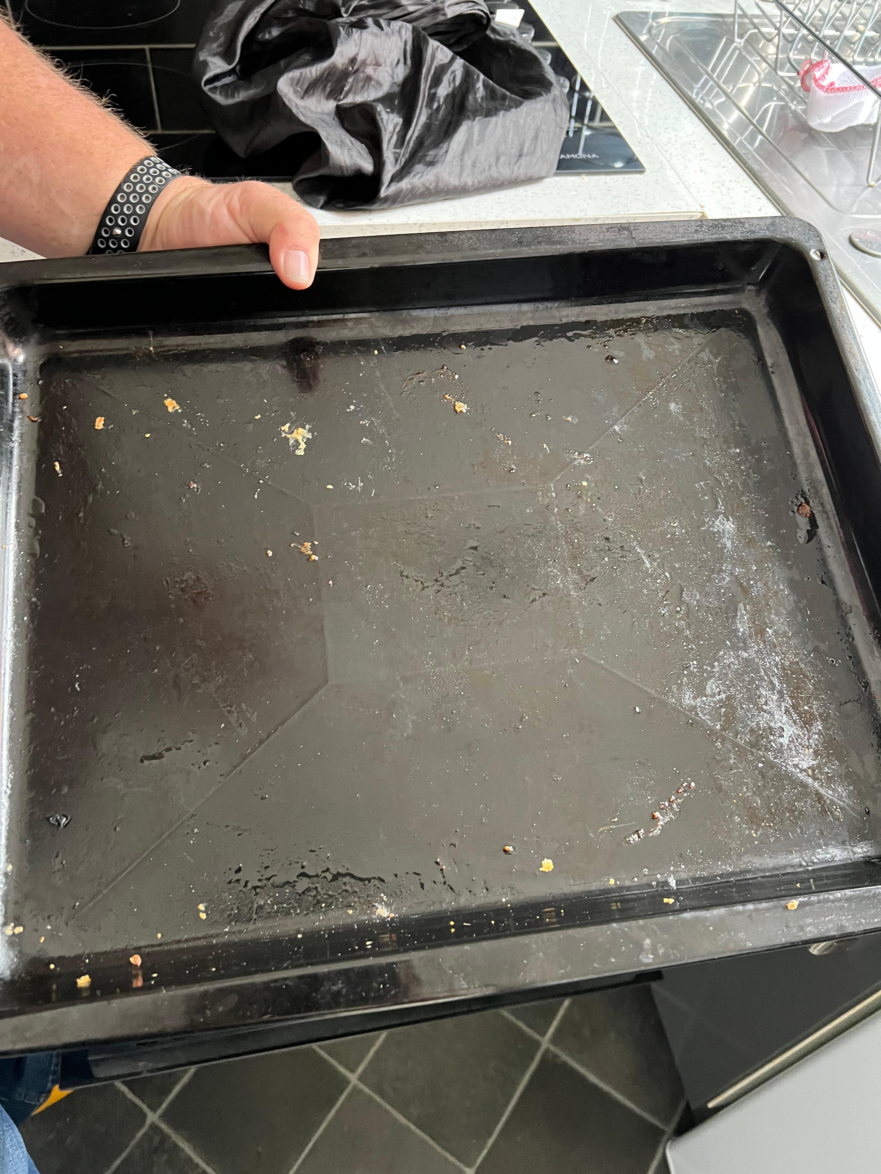 How we found the cleanliness of the oven tray in kitchen.