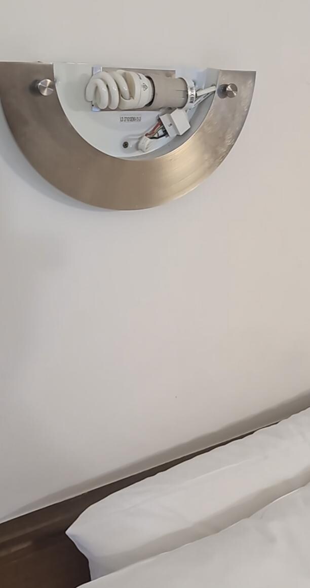 Exposed wires just above the bed and a child would have been able to touch. Feels me with horror. 