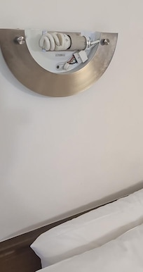 Exposed wires just above the bed and a child would have been able to touch. Feels me with horror.