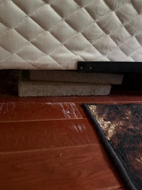 Cinder blocks "stabilizing" kids beds.