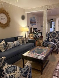 On the left side of as you walk into the lobby.