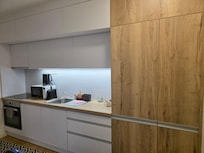 Modern kitchen stocked with coffee, tea and dishes. Also has fridge, stove, microwave and dishwasher and the bathroom has a washing machine.