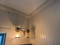 Only 1 light bulb in bathroom fixture and wall scorched