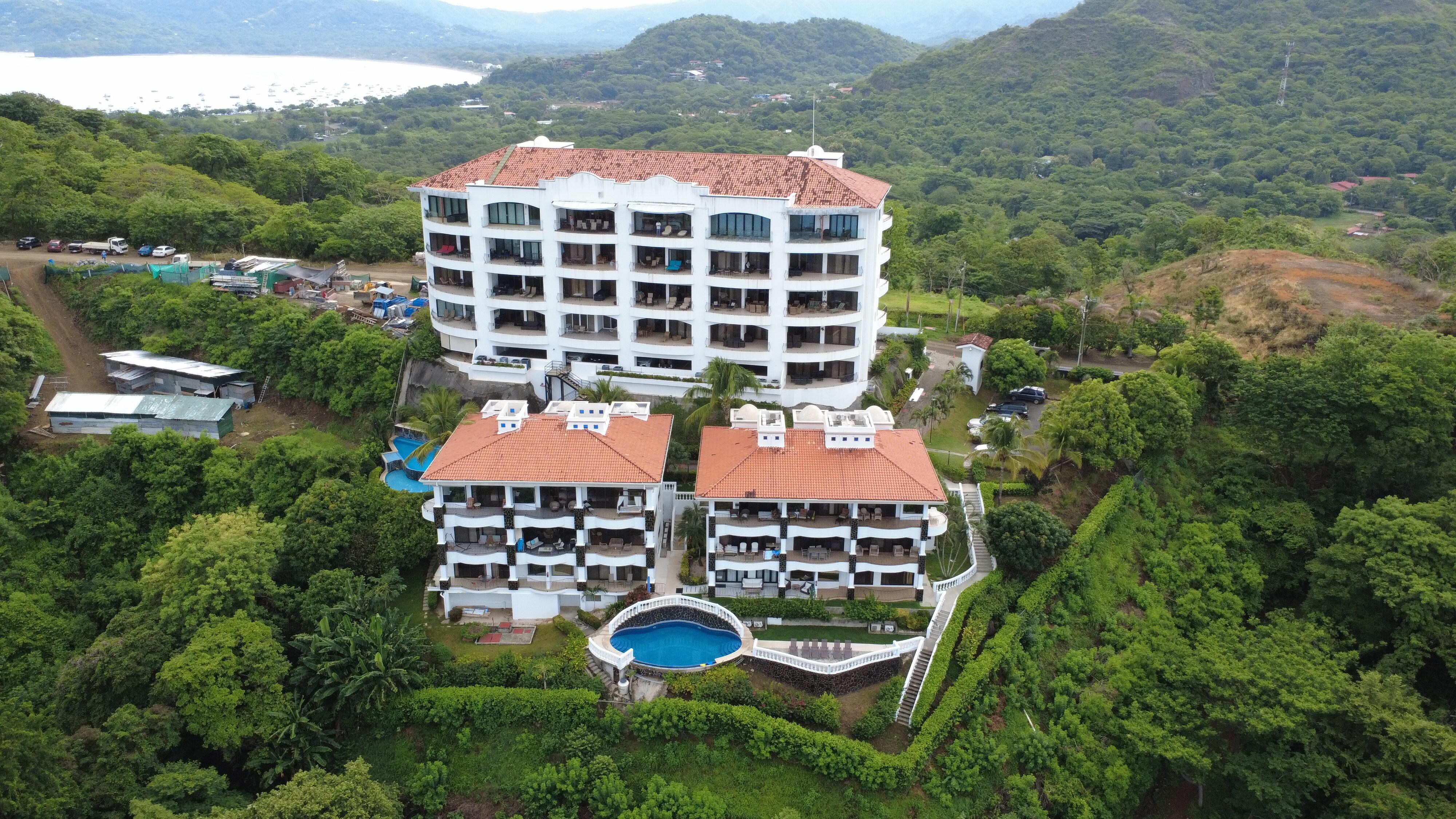 Unit is top floor, middle two lanai openings.