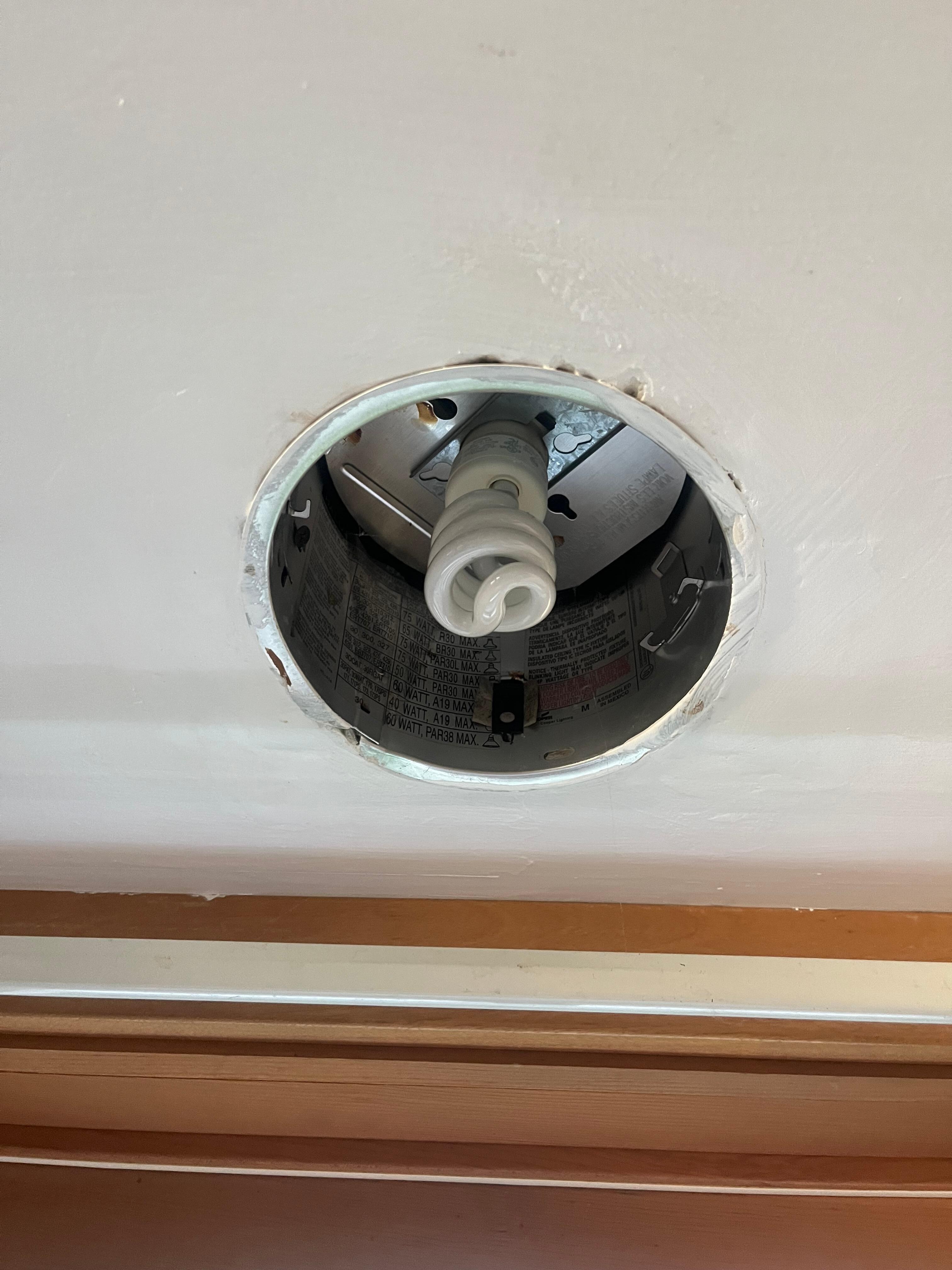 Exposed can light in kitchen