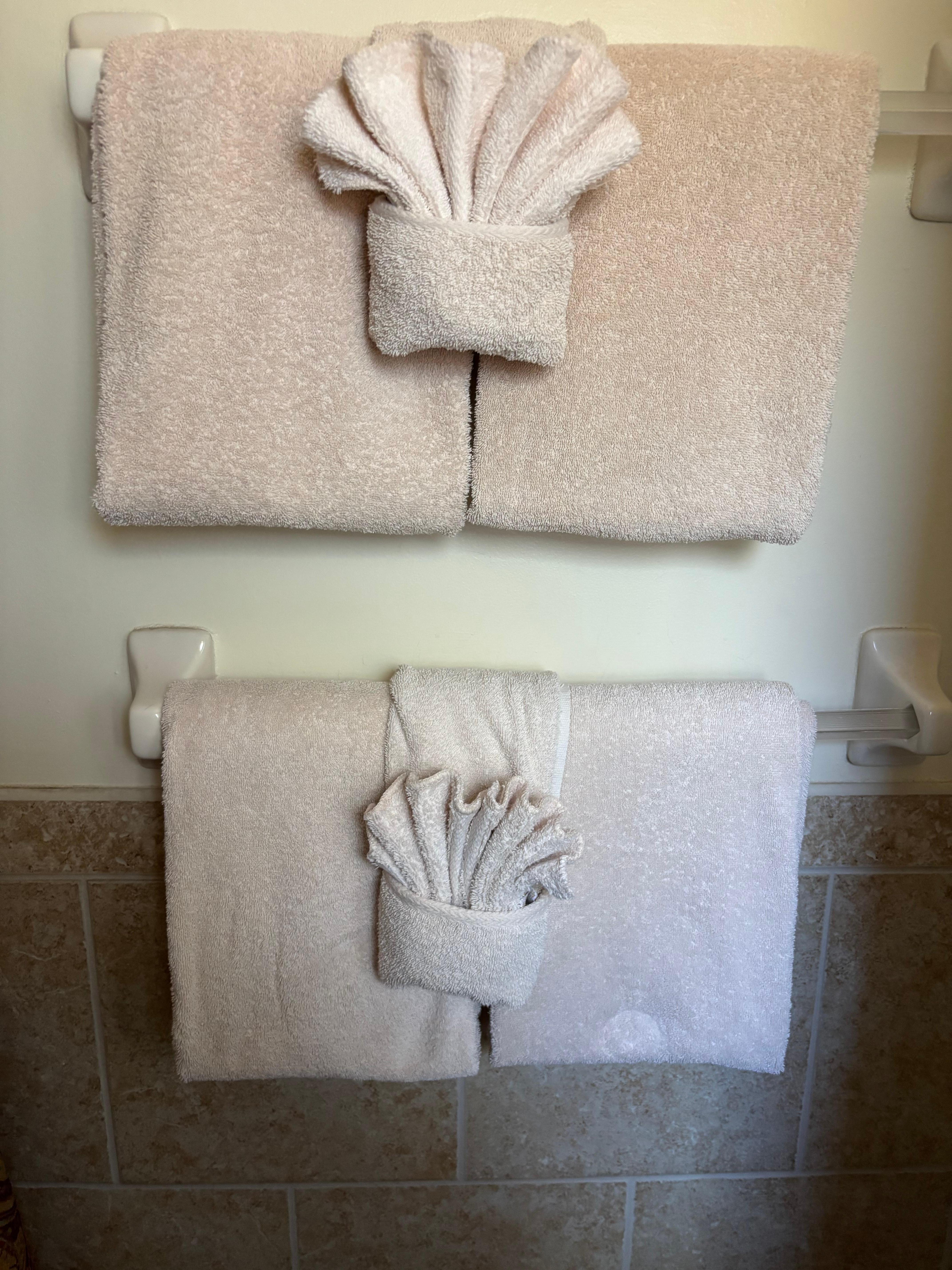 Towels folded nicely on bathroom