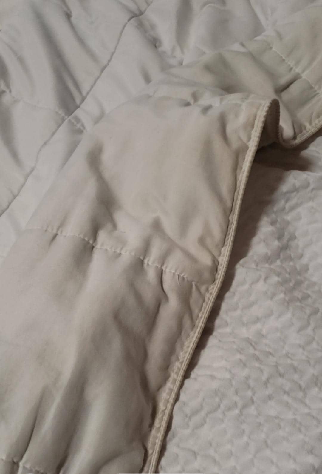 Dirty bed comforter, yellow, brown, dirty stains