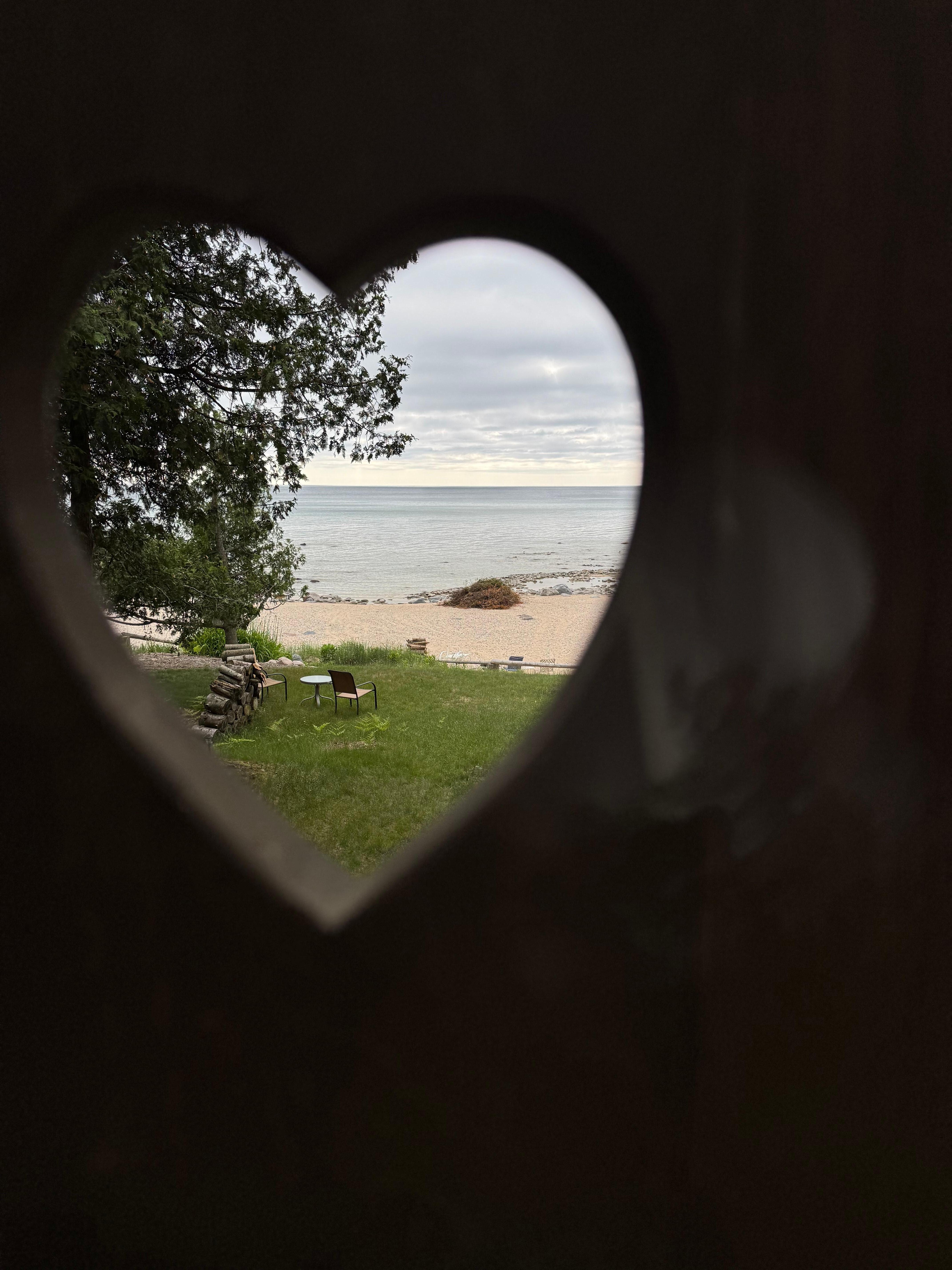 Details of the deck- a heart-shaped carving in the handmade bench.