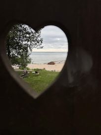 Details of the deck- a heart-shaped carving in the handmade bench.