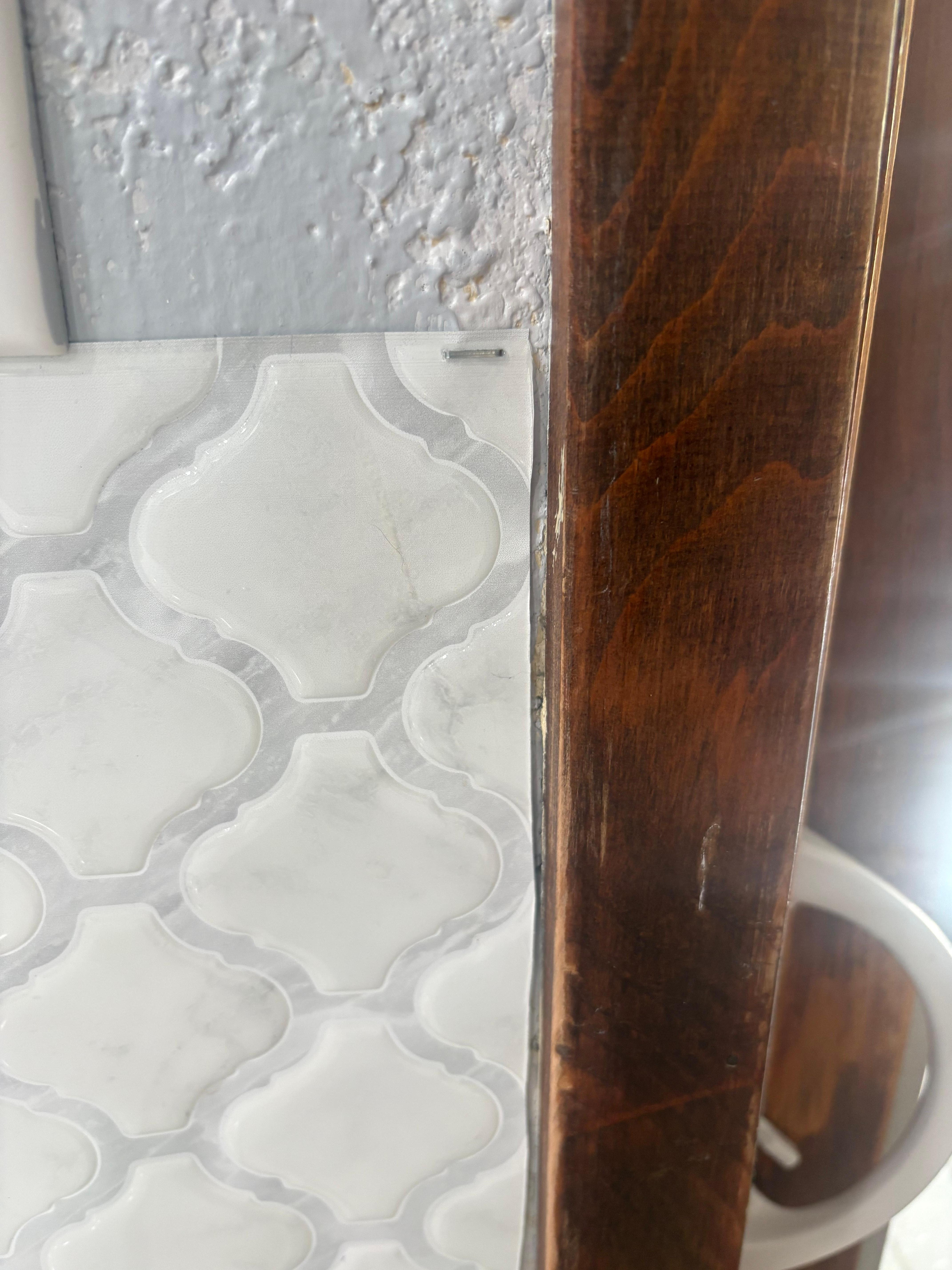 Stapled vinyl backsplash 