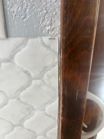 Stapled vinyl backsplash