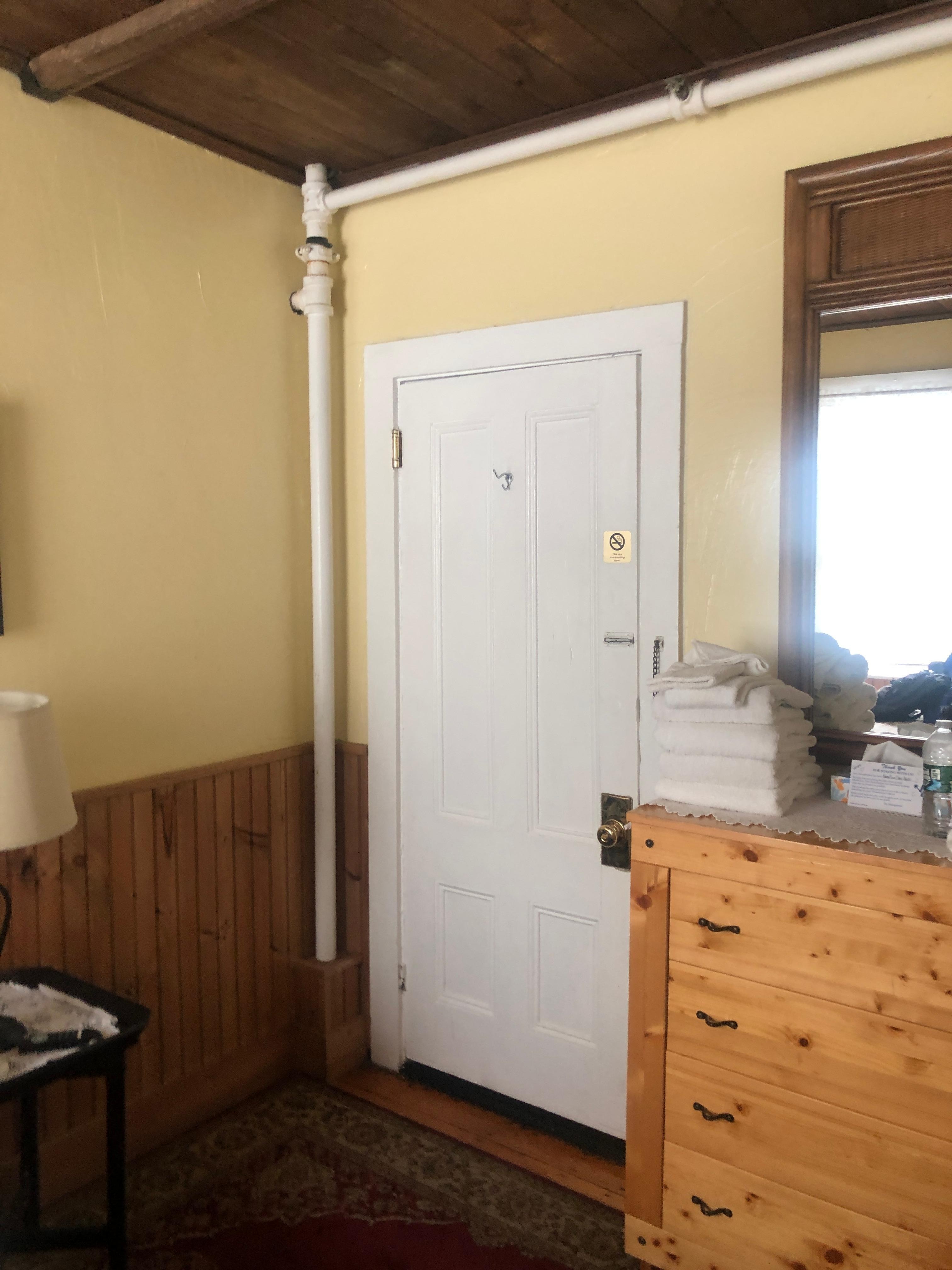 Room view of door frame with bottom gap.