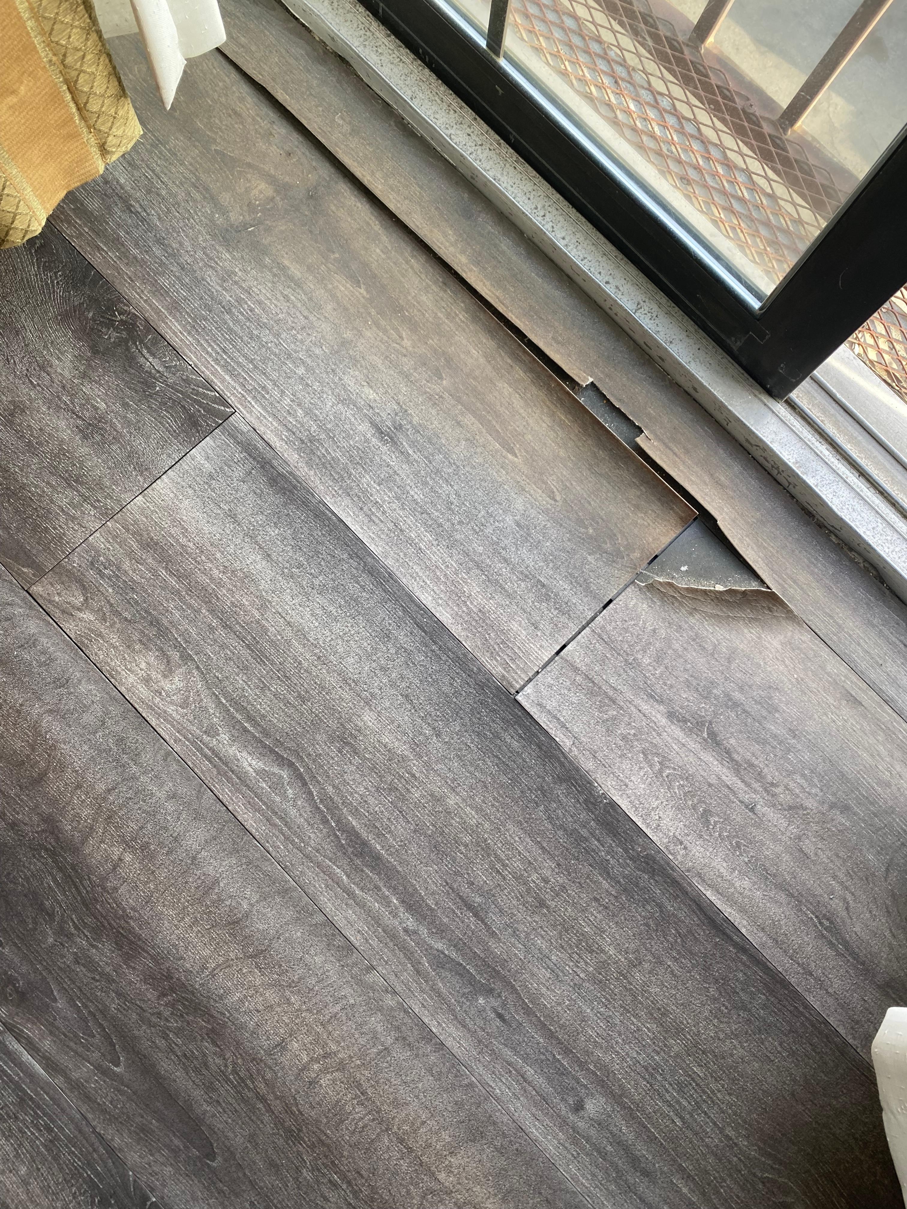 Another angle of the floor by the back door that was rippled & tearing up
