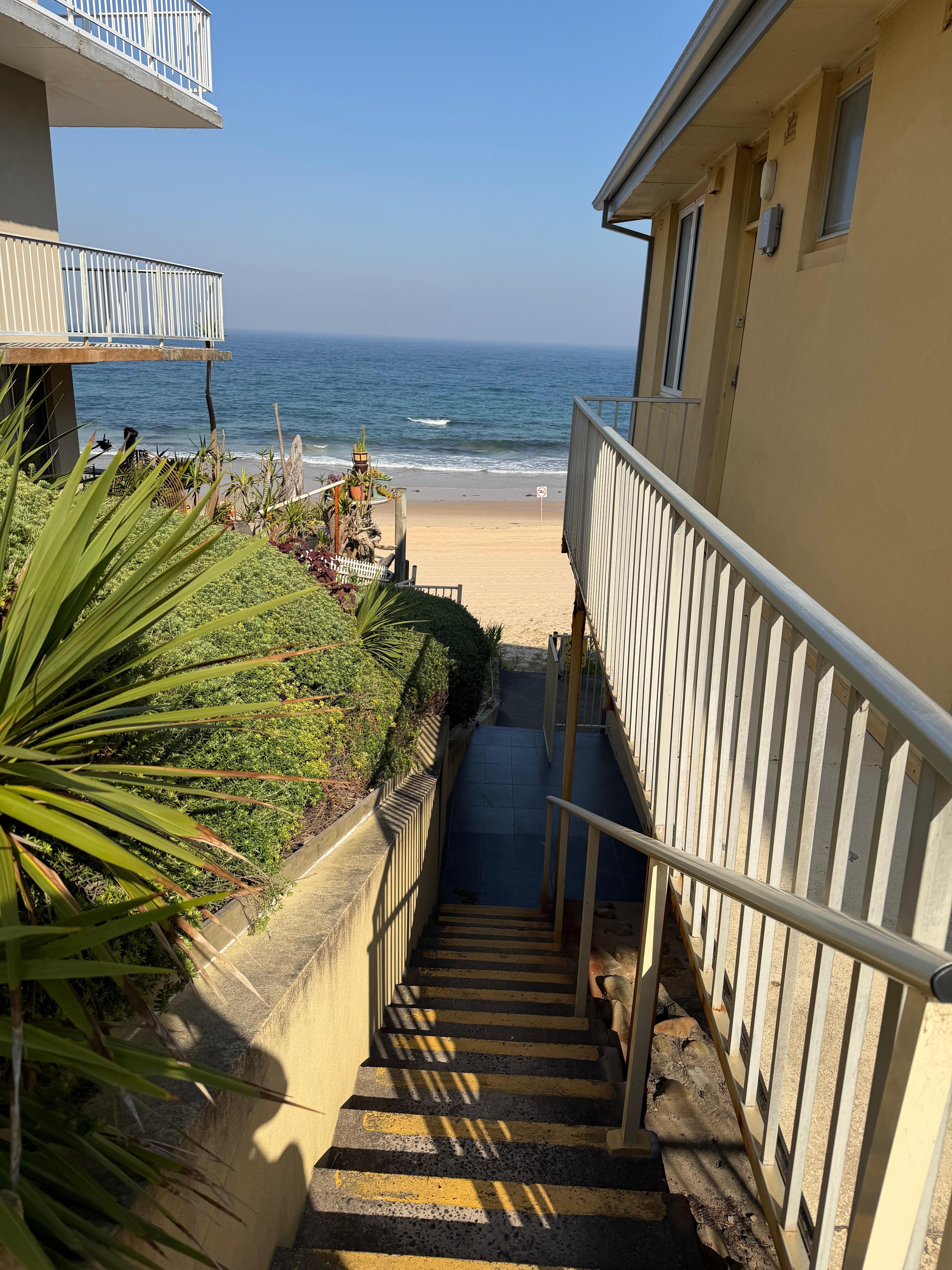 Steps (beside the front entrance) to get to the beach 