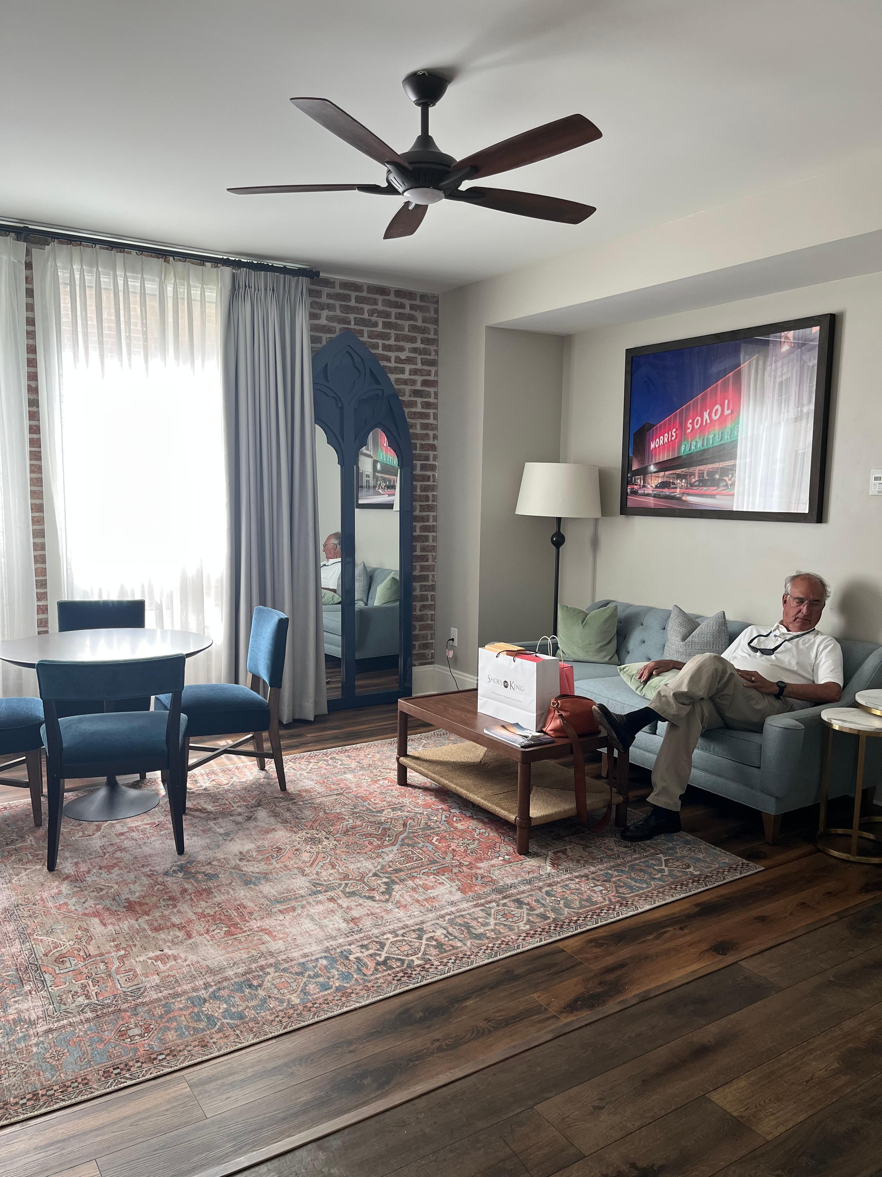 The living room area, with a half bath adjoining. 