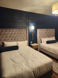 Typical queen beds, very comfortable. Great bathroom. Safe & mini fridge.