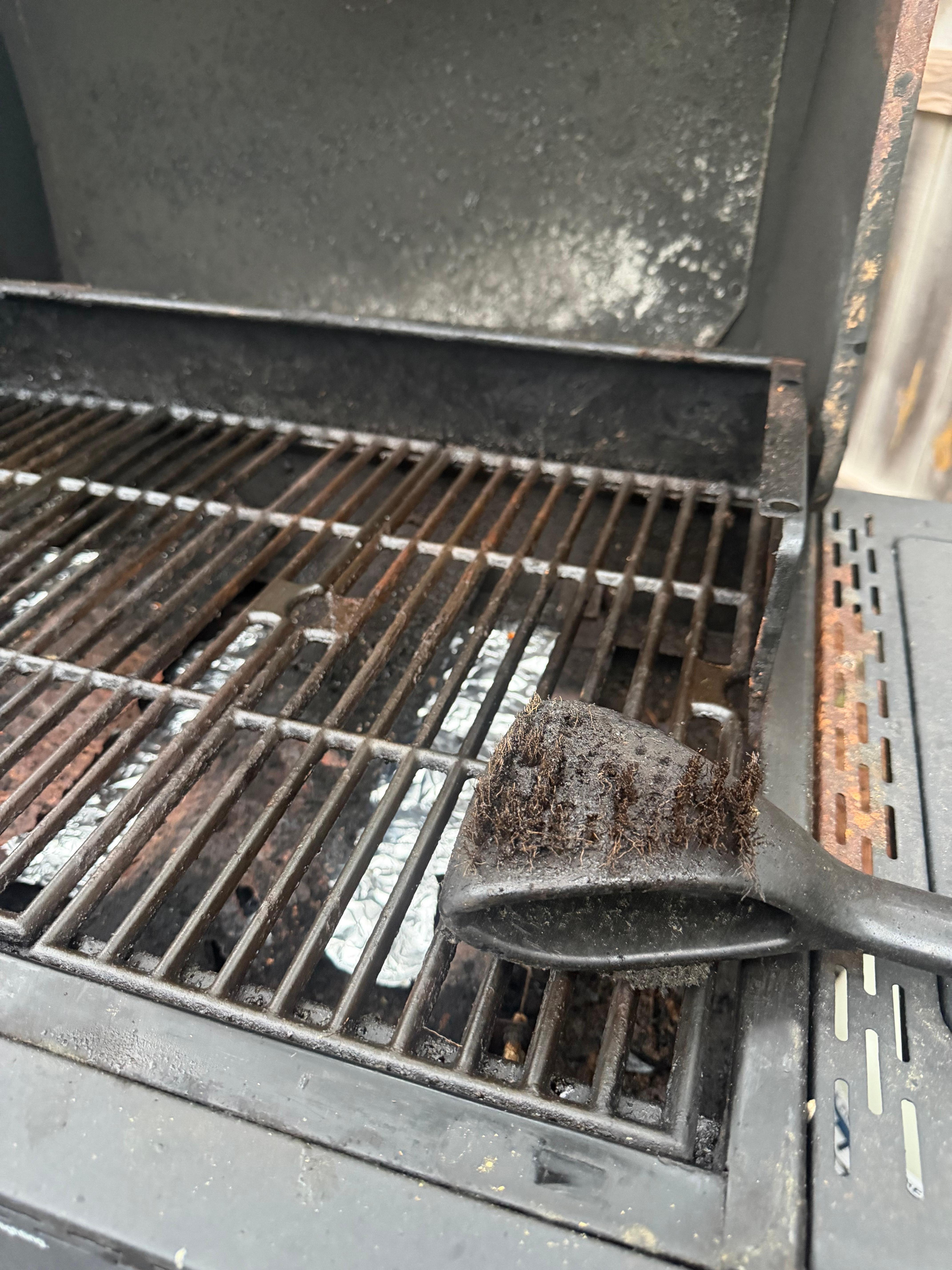 Dirty bbq with a melted no wire brush to clean with