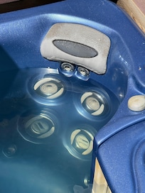 Murky hot tub and dirty head rest