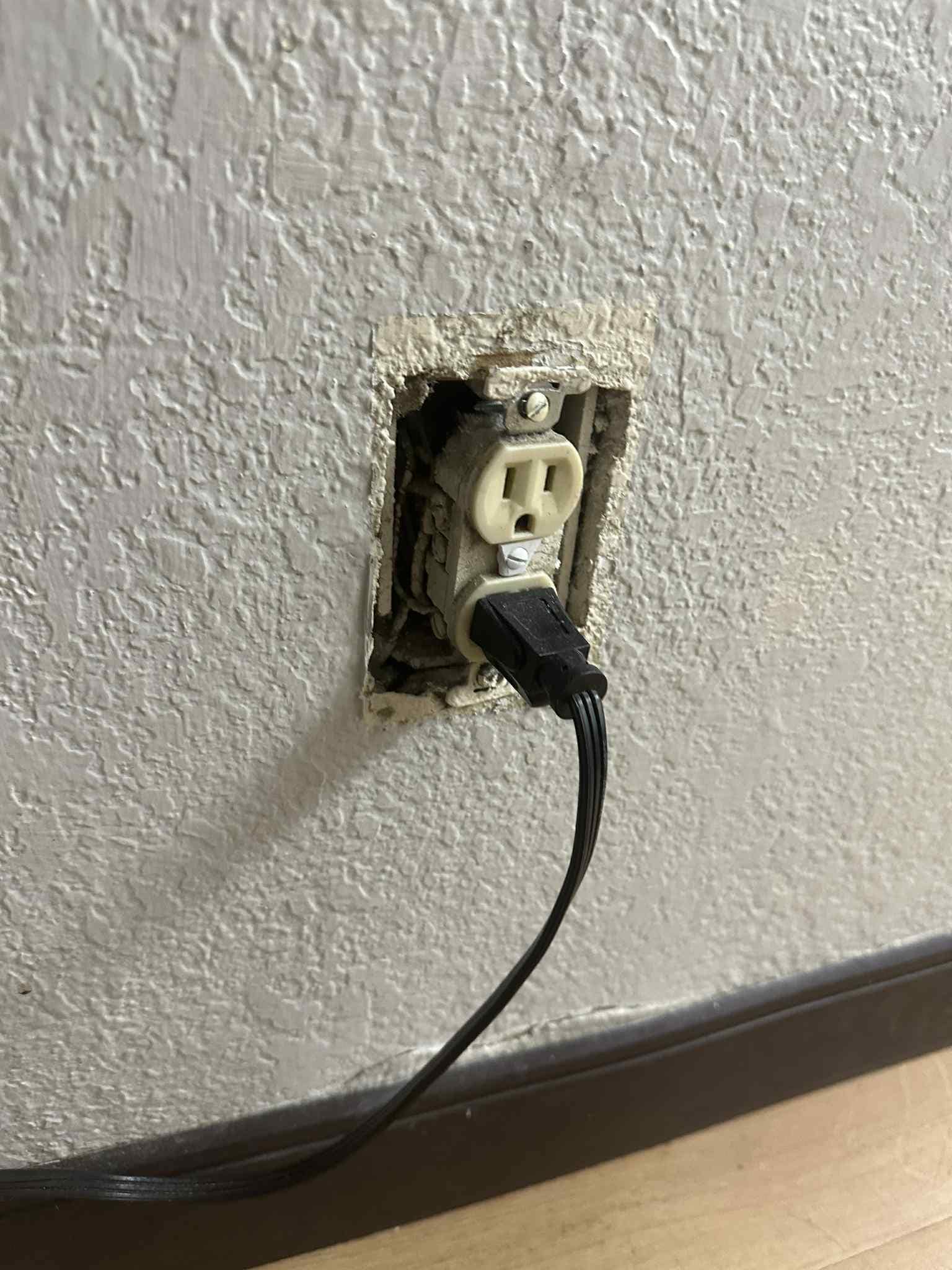 Missing outlet cover - the hotel's microwave is what is plugged in here