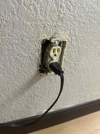 Missing outlet cover - the hotel's microwave is what is plugged in here