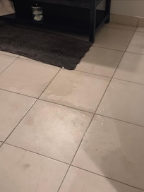 Water spread to the vanity and soaked the mat.