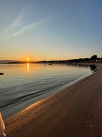 Sunset on the beach in front of Maude’s Place