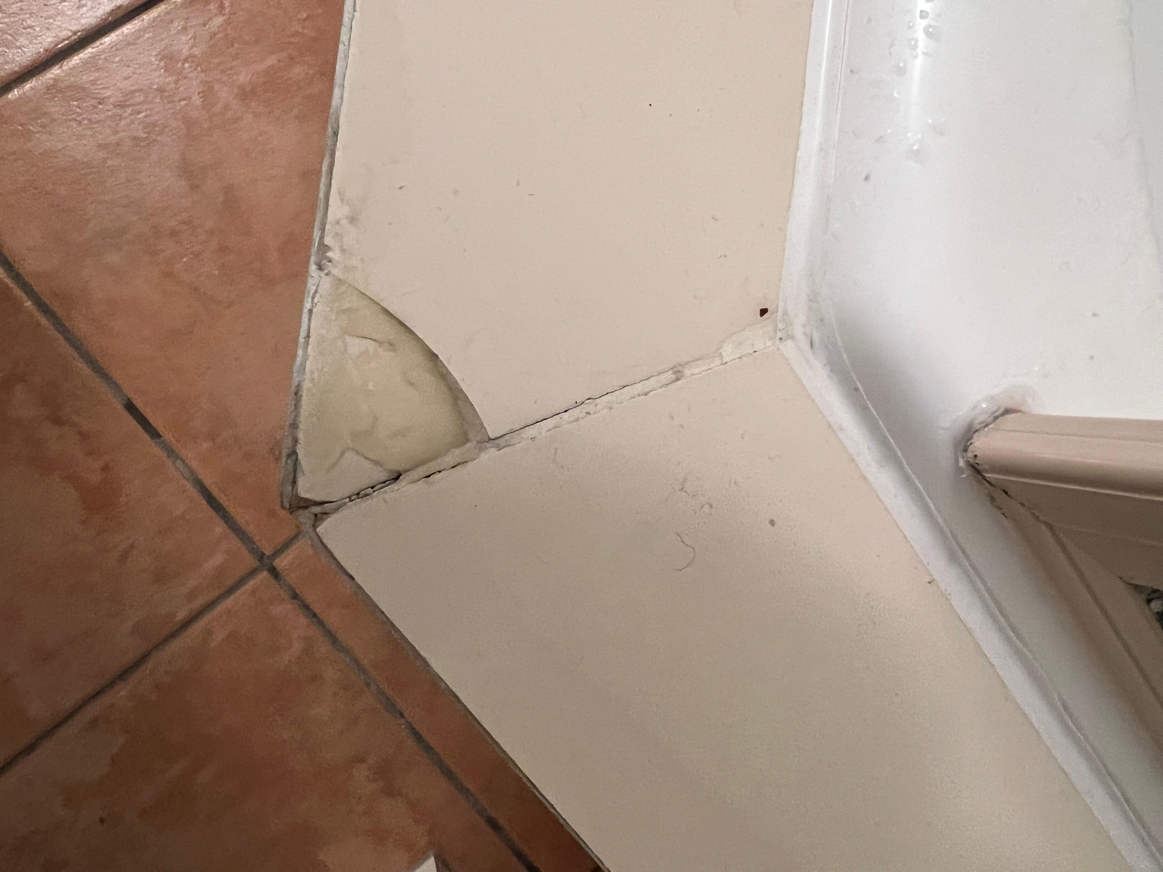 Cracked tile on bath shower