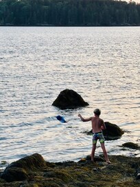 swimming and crabbing in front of the house