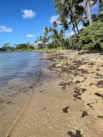 On beach looking West