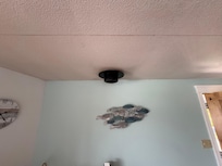 The hole in the ceiling for the chimney of a stove that has been replaced (and a red 'construction line' on the ceiling)
