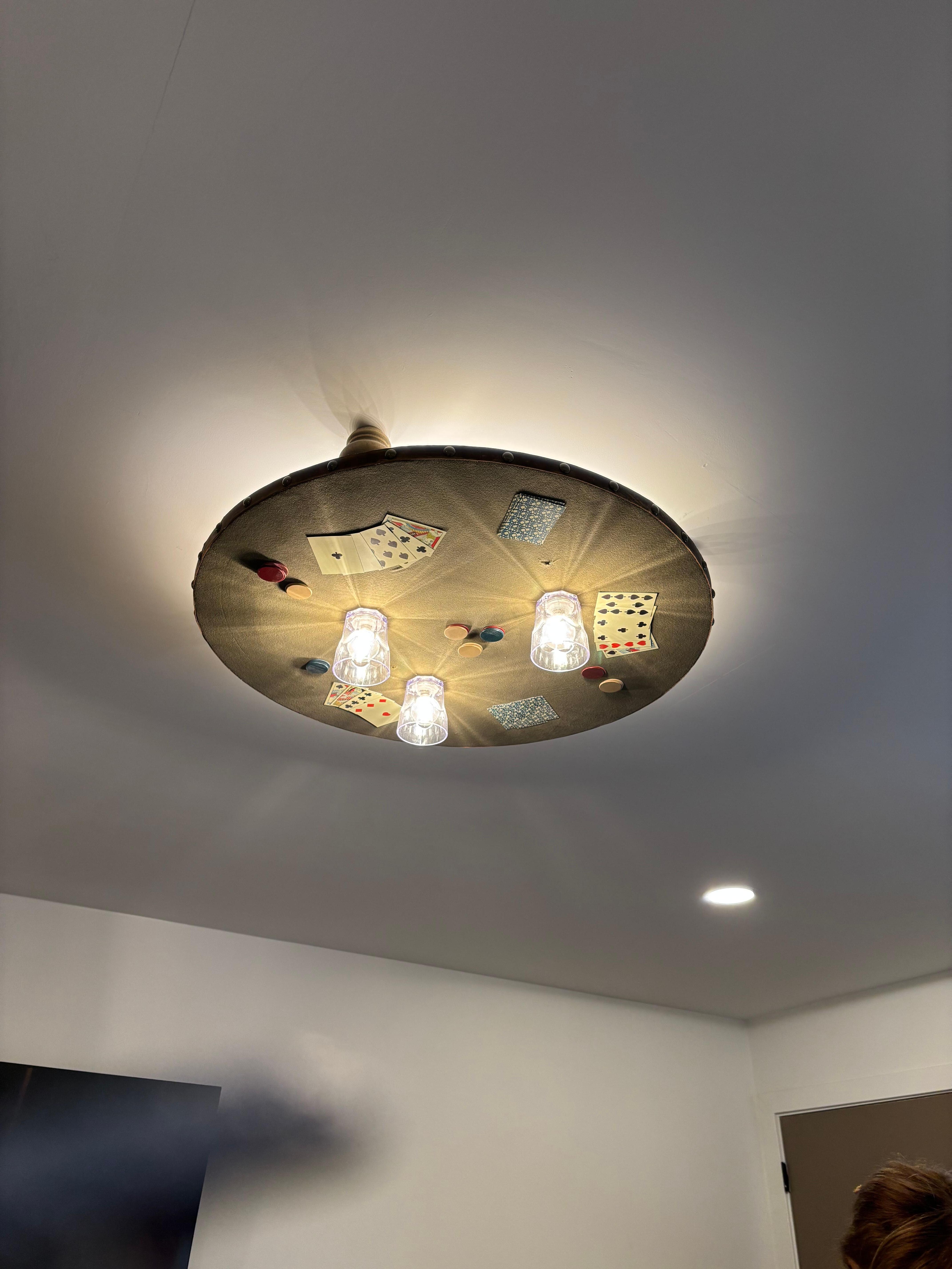 This ceiling light was so cool, a poker table. 