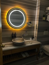bathroom with a lit mirror