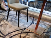 Dirty stained seats and carpet in restaurant