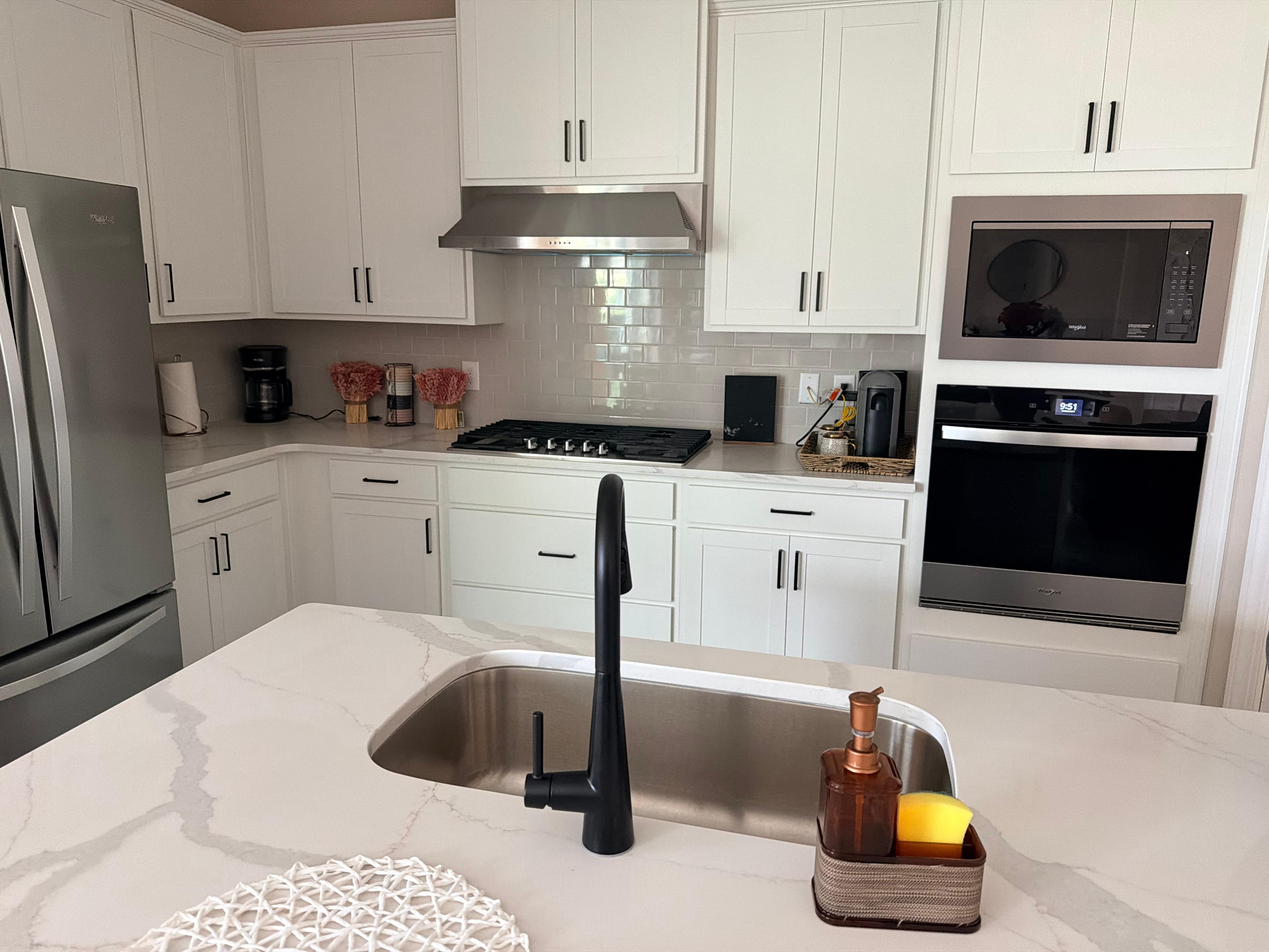 The microwave that doesn’t exist is pictured here above the stove