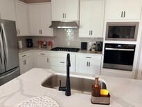 The microwave that doesn’t exist is pictured here above the stove